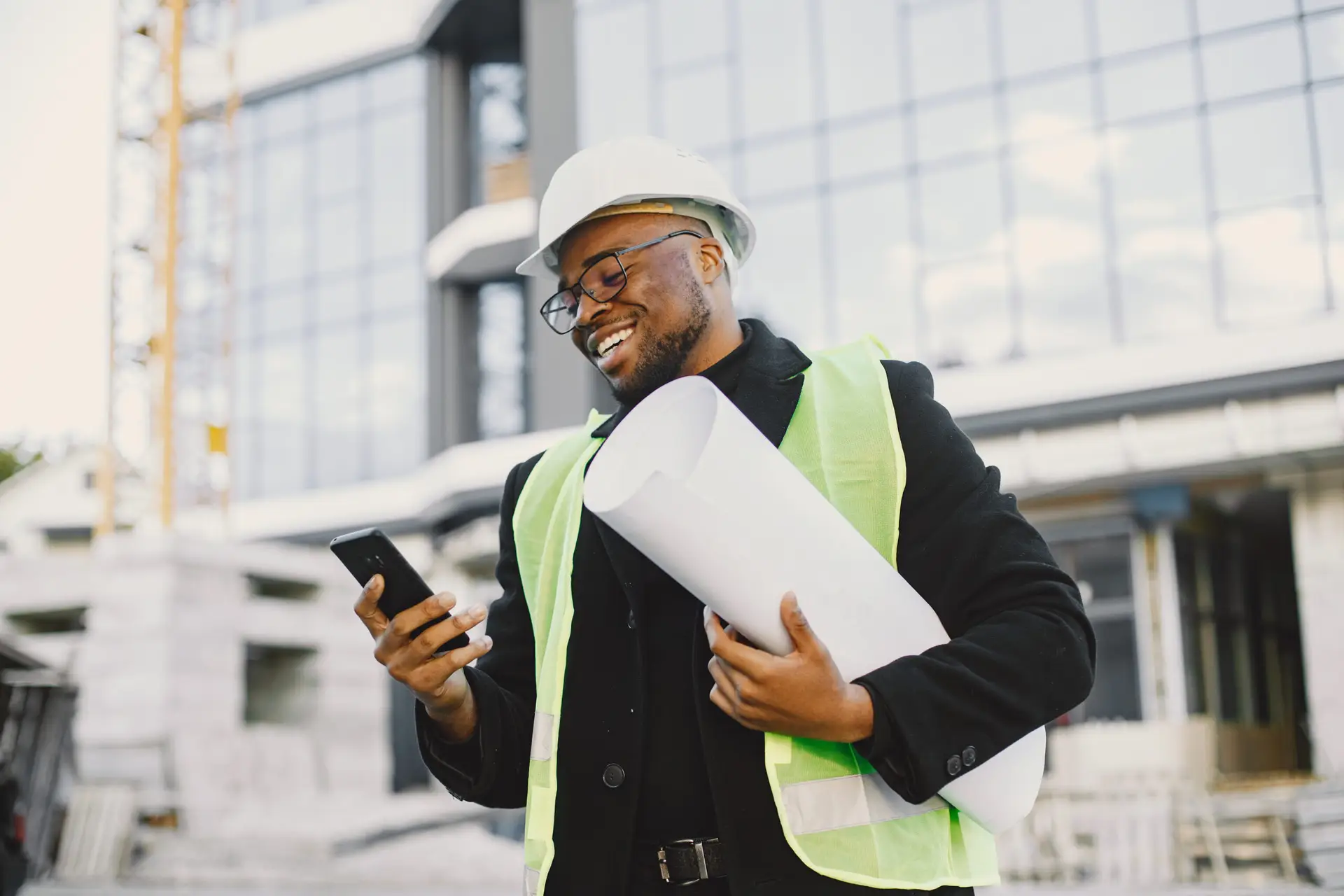 black architect with project talk by phone